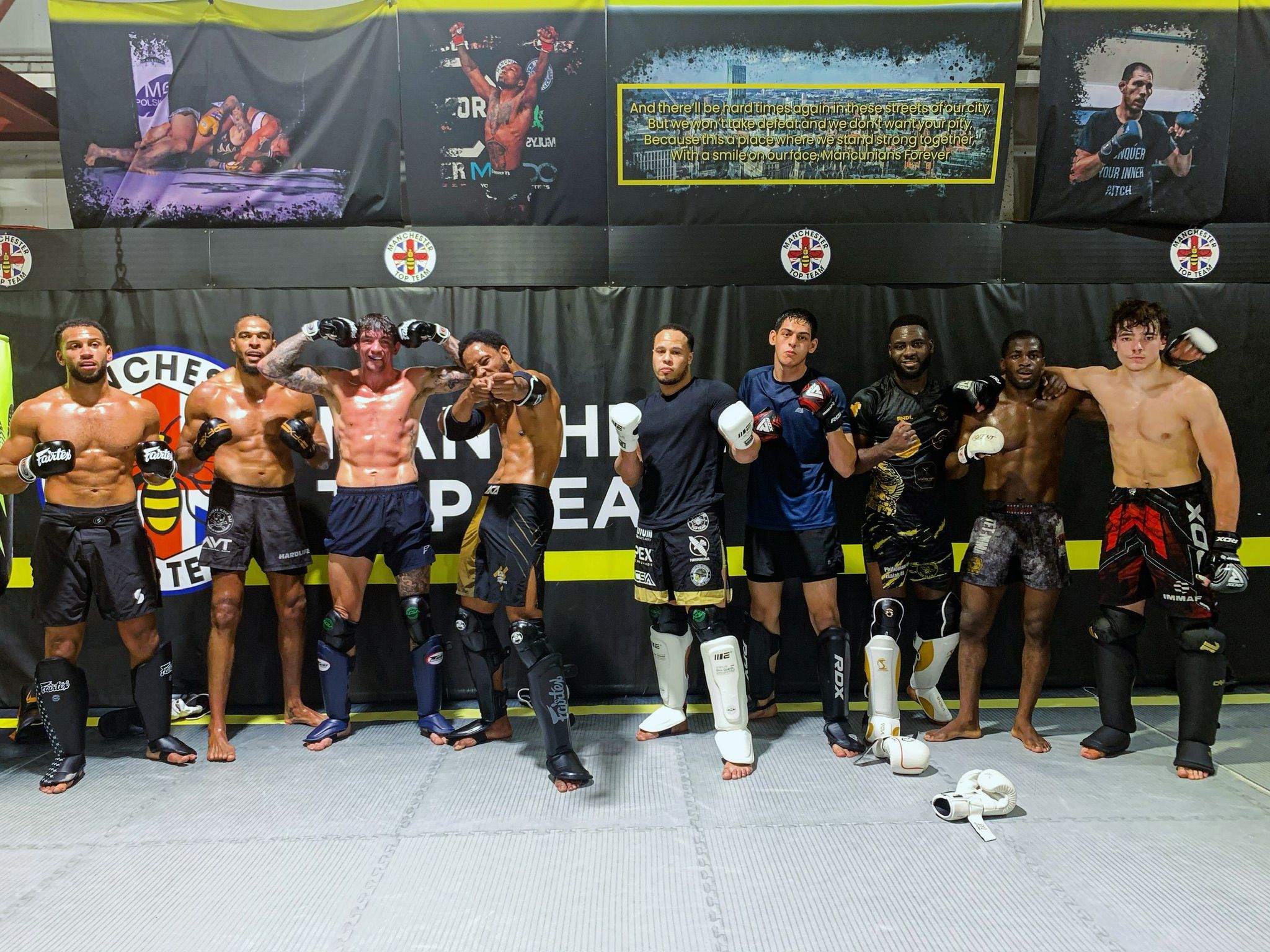 Manchester Top Team pro fighters lined up in the gym